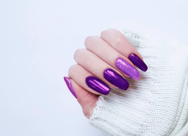 female hand manicure sweater female hand manicure sweater artificial nail stock pictures, royalty-free photos & images