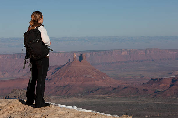 Female Hiker Looking Out Over A Canyon stock photo