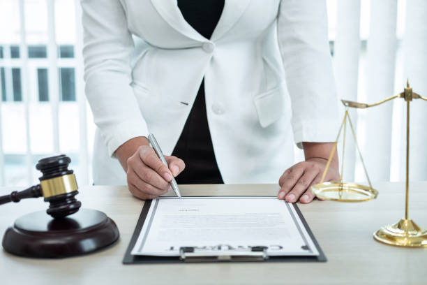 Female lawyer working with legal case document contract in office, law and justice, attorney, lawsuit concept stock photo