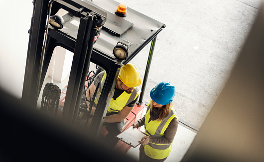 Female Manager Talking To Forklift Operator Stock Photo Download Image Now Istock