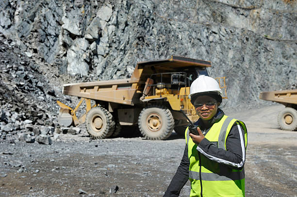 Female mine official supervises work stock photo
