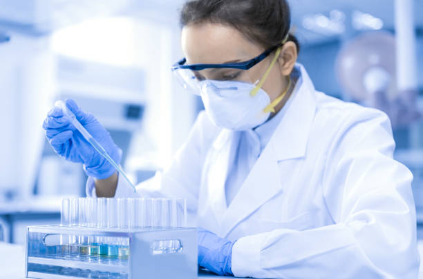 Female scientist working in the CDC laboratory. stock photo