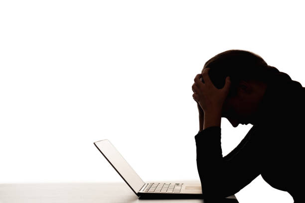 female silhouette overwork burnout woman laptop stock photo