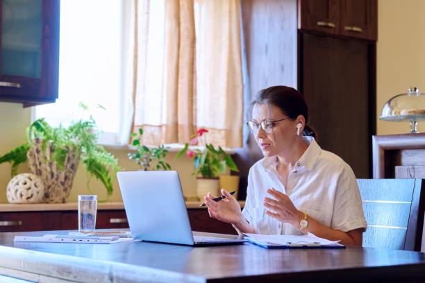 Female teacher, mentor, psychologist at online therapy meeting stock photo