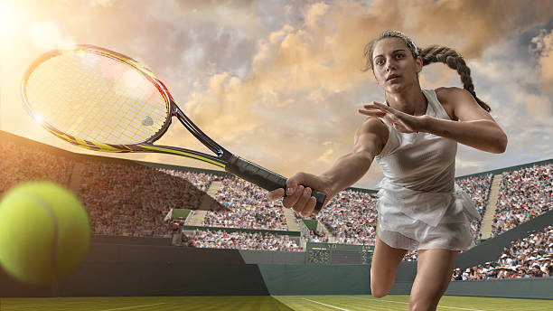 female tennis player about to strike ball - wimbledon tennis stok fotoğraflar ve resimler