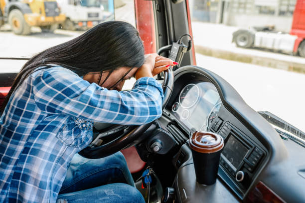 Female truck driver sleeping. stock photo