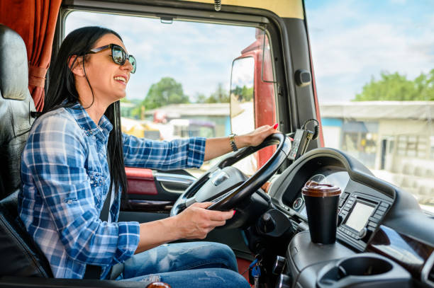 Female truck driver to transport stock photo