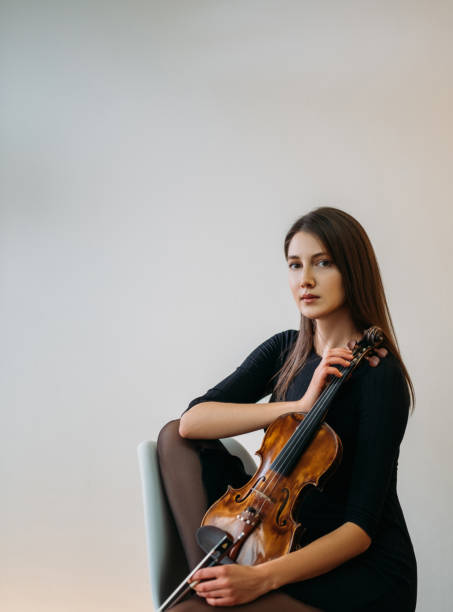 female violinist portrait studio shooting classic stock photo