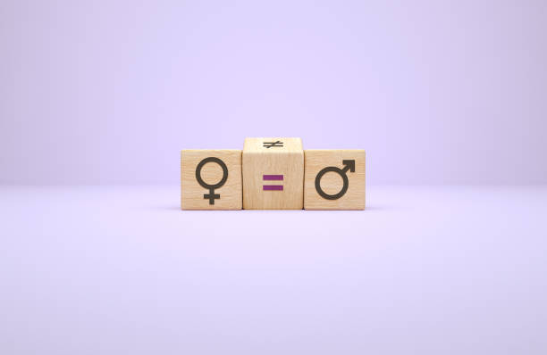 Feminism and equality concept between women and men with wooden cubes. International womens day stock photo