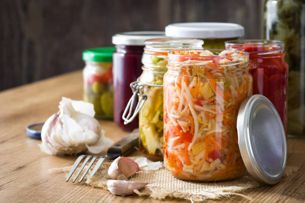Fermented preserved vegetables in jar stock photo