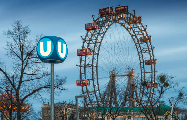Ferris wheel Riesenrad and underground sign U. Vienna, Austria stock photo