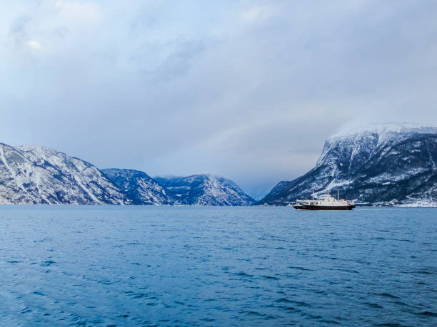 Ferry boat in Lærdal Fodnes in Vestland, Norway. In the winter fjord landscape. stock photo