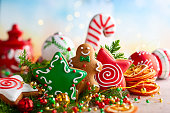 istock Festive concept with Christmas gingerbread in the shape of a star, fir branches and winter spices. 1174662164