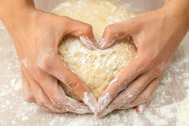 Festive dough in loving hands stock photo