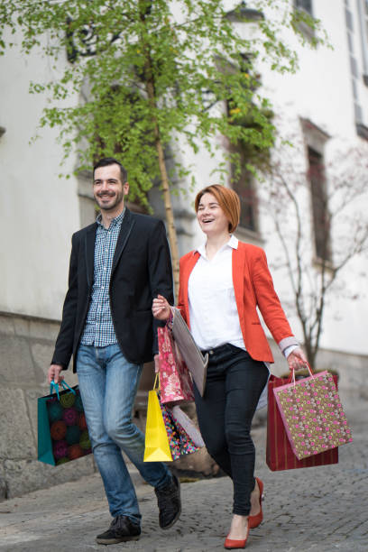 Young couple with shopping bags.