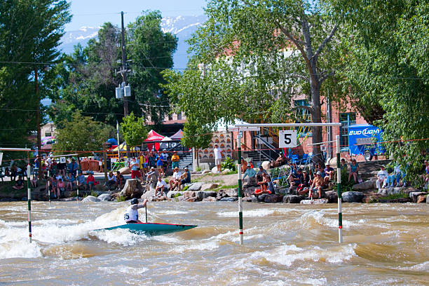 Fibark Whitewater Festival in Salida Colorado 2015 Salida, Colorado, USA - June 20, 2015: Competitors race through gates on a course in the Arkansas River in the Salida Whitewater Park while spectators watch from the banks in the 2015 Fibark Whitewater Festival near Sackett Avenue in Salida, Colorado salida colorado stock pictures, royalty-free photos & images