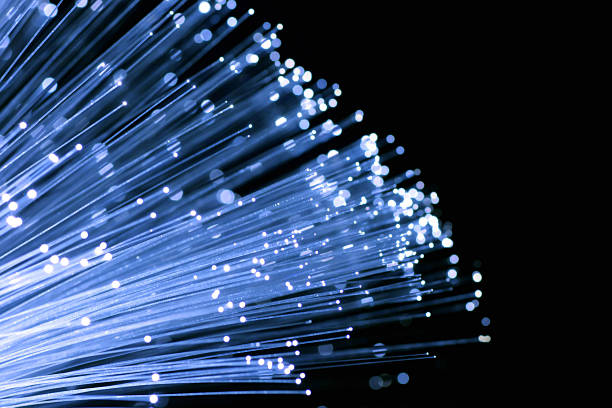 Fiber optic cables reaching outwards stock photo