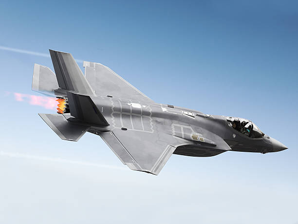 F35 Fighter jet at supersonic speeds stock photo