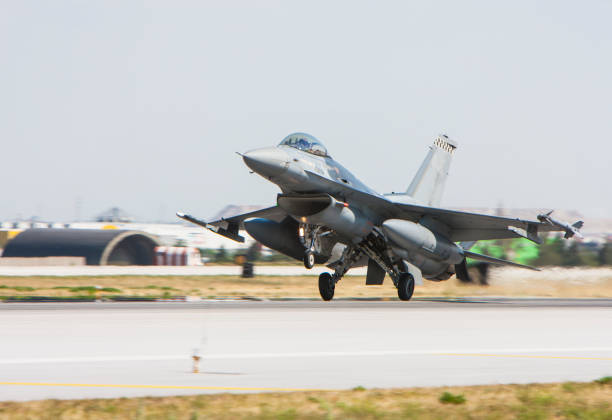 F-16 Fighter Jet taking off F-16 Fighter Jet taking off defense industry stock pictures, royalty-free photos & images