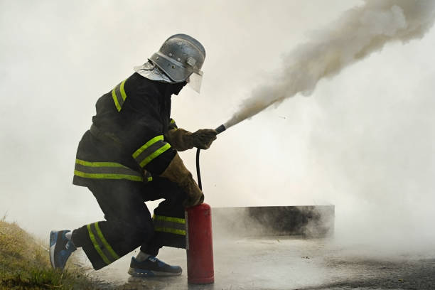 fighting fire during training stock photo