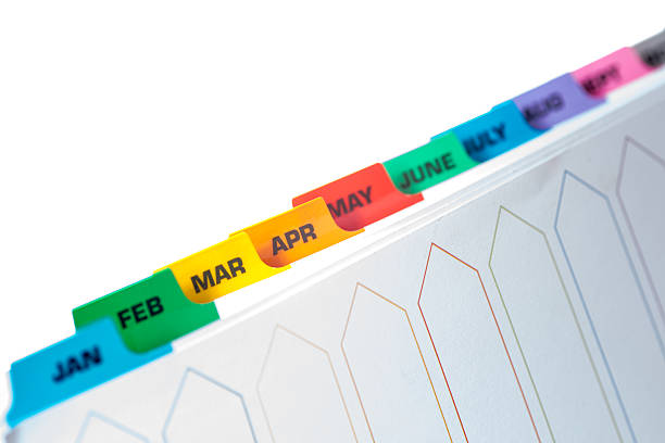 Filing Separators with coloured monthly tabs stock photo