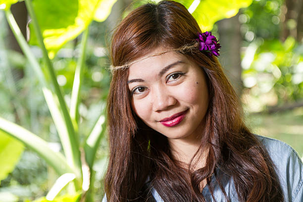 Filipina woman in a garden Pinoy woman in a green garden on farm filipino woman stock pictures, royalty-free photos & images