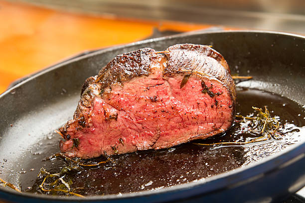 Fillet of beef in pan stock photo