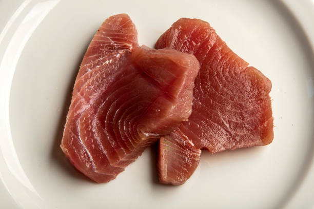 Fillet of Red Tuna Fish on plait stock photo