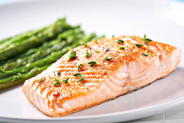 Fillet of salmon with asparagus stock photo