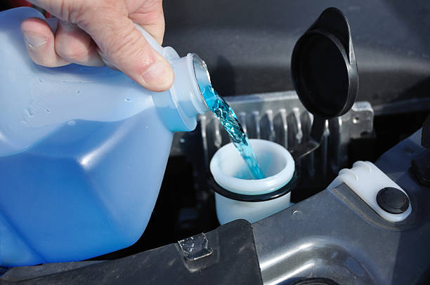 Filling the Windshield Washer Fluid stock photo
