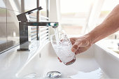 istock Filling up a glass with drinking water from bathroom tap 1394387101