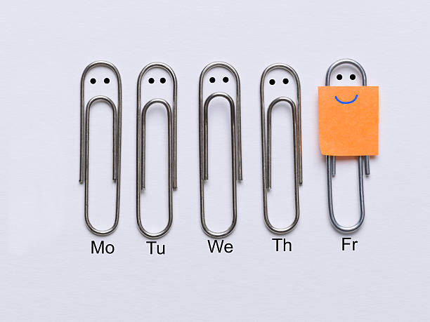 Finally it's Friday Row of clips appearing sad faces except the corresponding clip smiley face that has come the weekend happy friday stock pictures, royalty-free photos & images