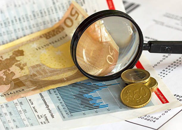 Finance: Price index graph magnifying glass and euro currency Price index graph magnifying glass and euro currency Dow Futures stock pictures, royalty-free photos & images