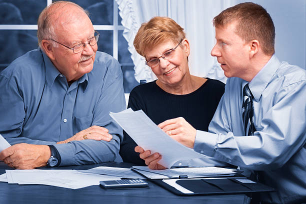 Financial advisor helping seniors stock photo