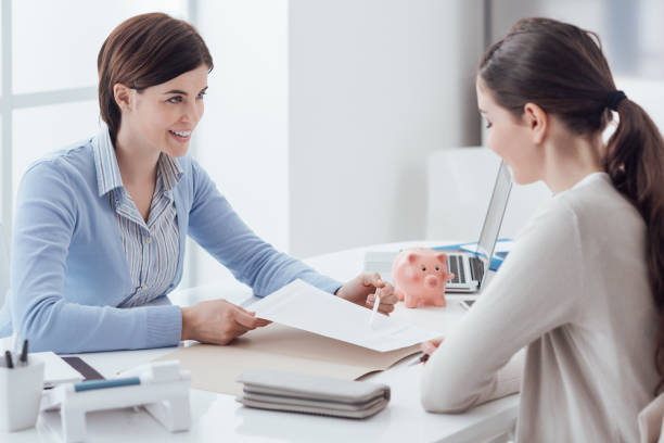 Financial planning Business consultant and customer meeting in the office, the businesswoman is holding a contract and pointing bank account stock pictures, royalty-free photos & images