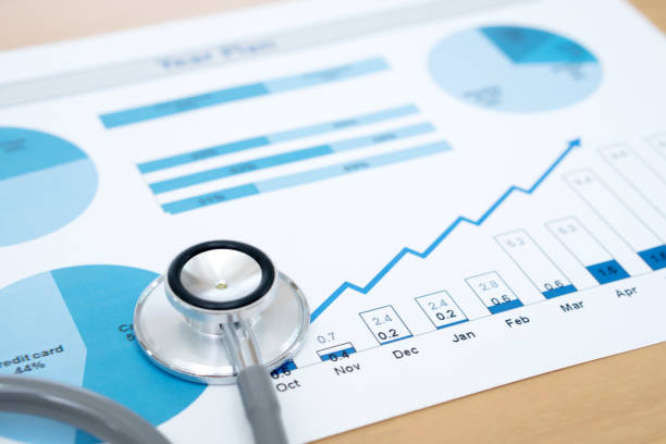 Financial report chart and calculator Medical Report and stethoscope stock photo