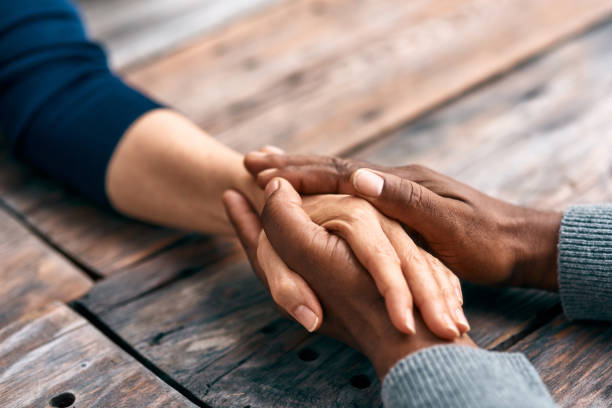 I find comfort in being with you Cropped shot of two unrecognizable people holding hands holding hands stock pictures, royalty-free photos & images