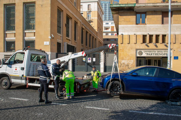 Fine and removal of the electric car from the road, using the tow truck. stock photo