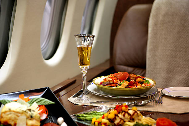 Fine dining in a luxury private jet Fine dining on board the Falcon 900 private airplane stock pictures, royalty-free photos & images