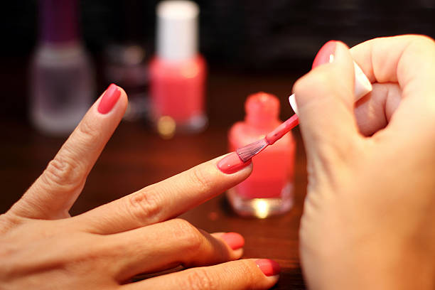 Finger nails painting Painting finger nails in red painting fingernails stock pictures, royalty-free photos & images