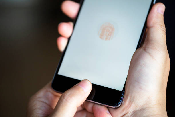 fingerprint on smart phone stock photo