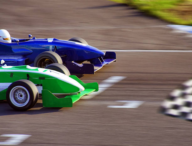 Finish Two formula cars speeding to finish line finishing photos stock pictures, royalty-free photos & images