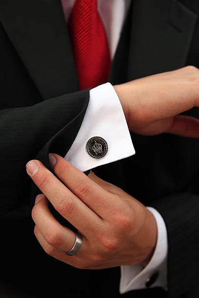 Finishing Touch On Suit - Cufflink stock photo