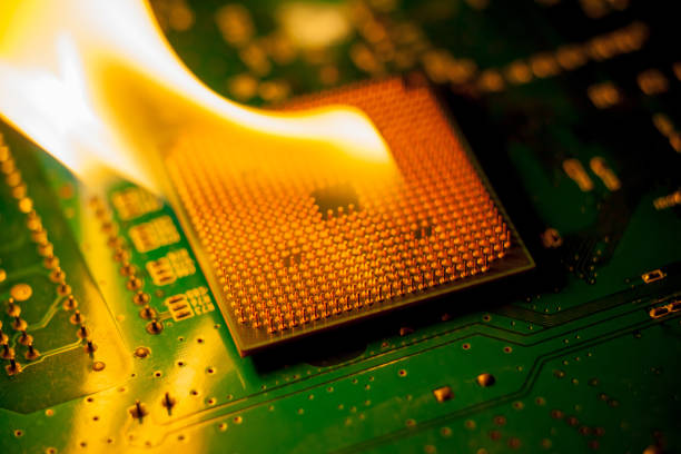 fire Burning cpu on circuit board with electronic stock photo