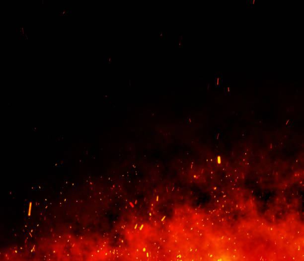 Fire embers particles over black background. stock photo