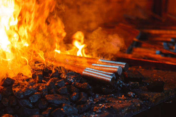 Fire in the furnace in the smithy, tools stock photo