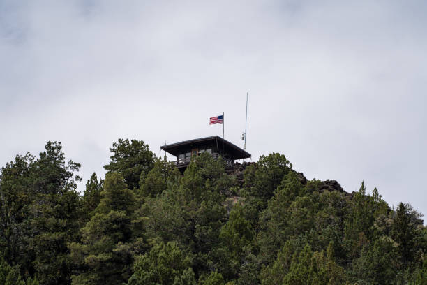 Fire lookout watchtower on top of Schonchin Butte in Lava Beds National Monument in California Fire lookout watchtower on top of Schonchin Butte in Lava Beds National Monument in California fire lookout tower stock pictures, royalty-free photos & images