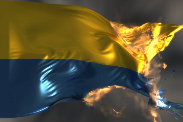 Fire on Ukrainian flag stock photo