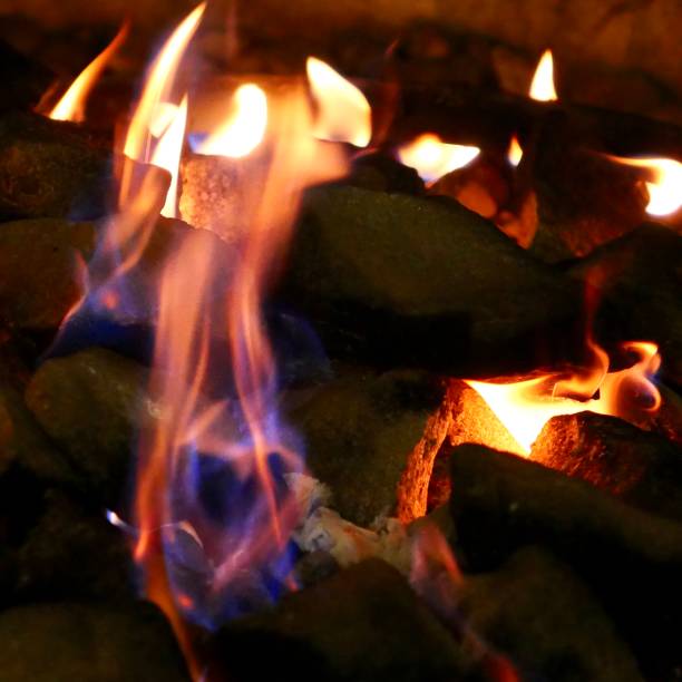 Fire Pit Flames Close up of flames burning in out door  fire pit firewalking stock pictures, royalty-free photos & images