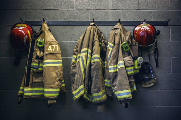 Firefighter firefighter protection clothe and respiratory mask firefighters stock pictures, royalty-free photos & images